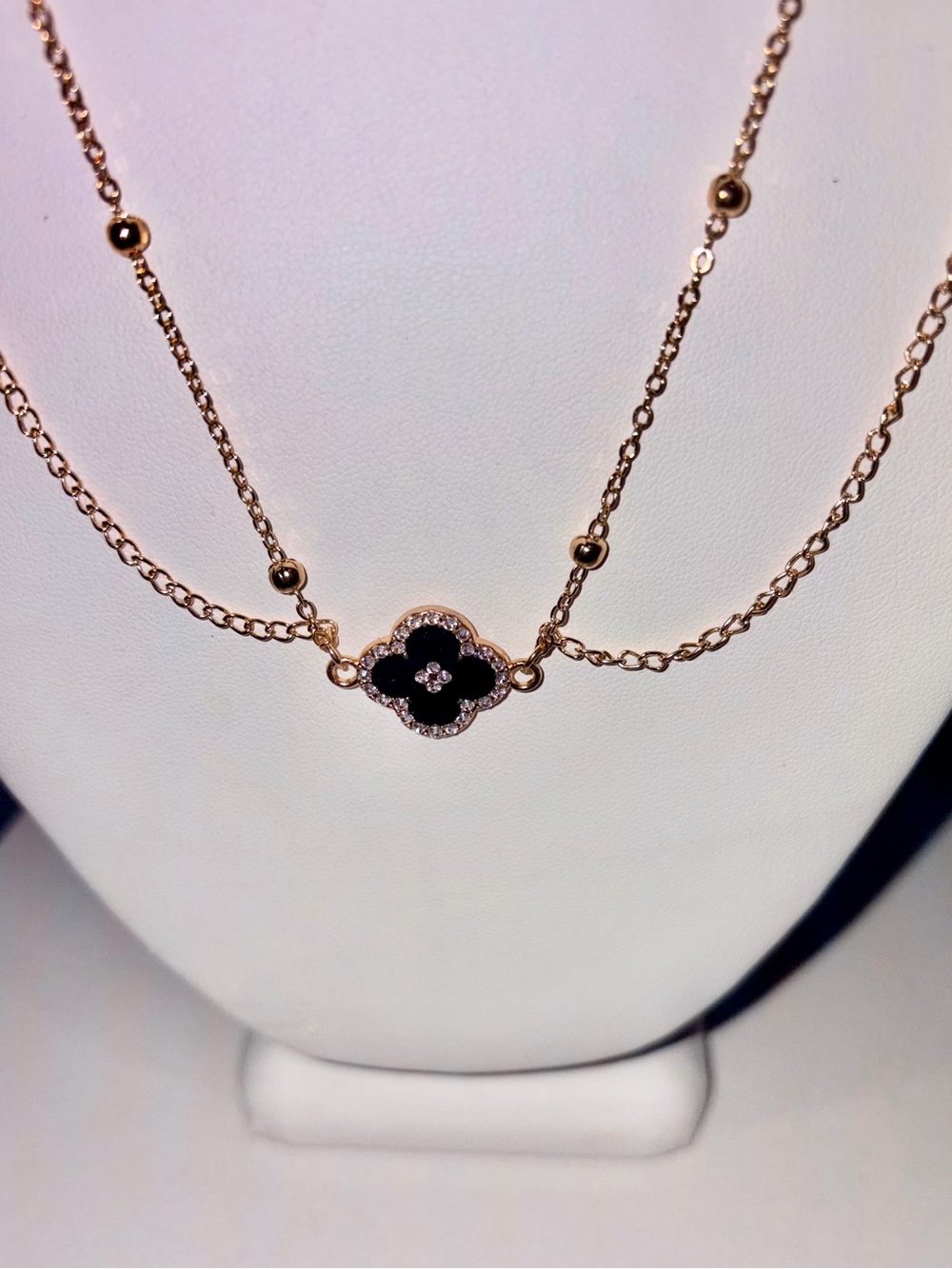 Gold Tone Layered Clover Motif Necklace with Black Enamel & Crystal Detail